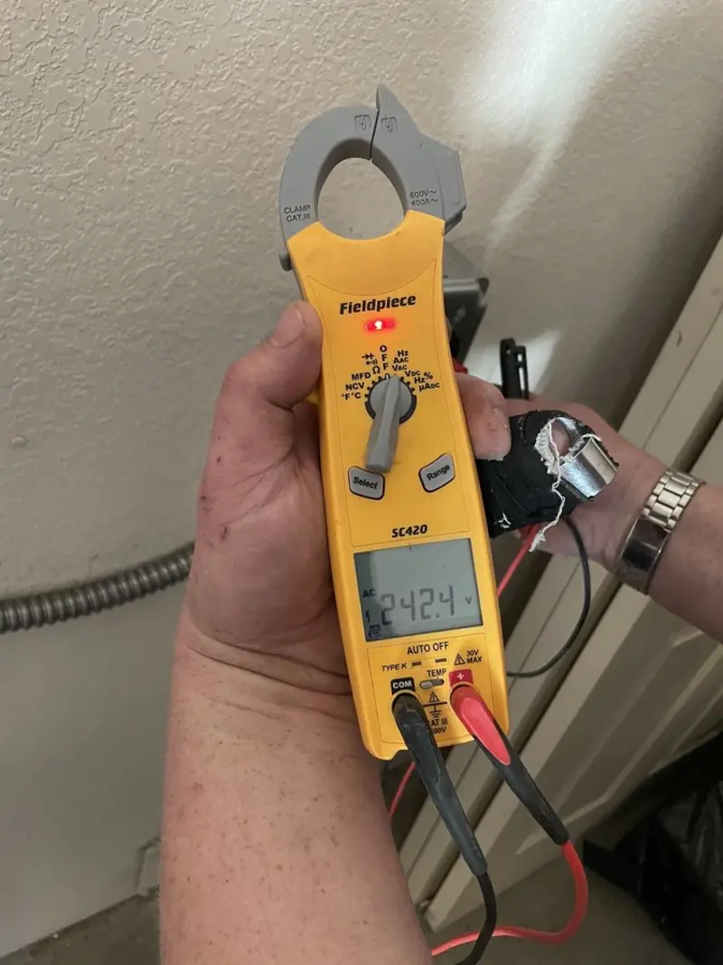 Voltage testing with clamp meter during Recessed Lighting Installation in Conewago